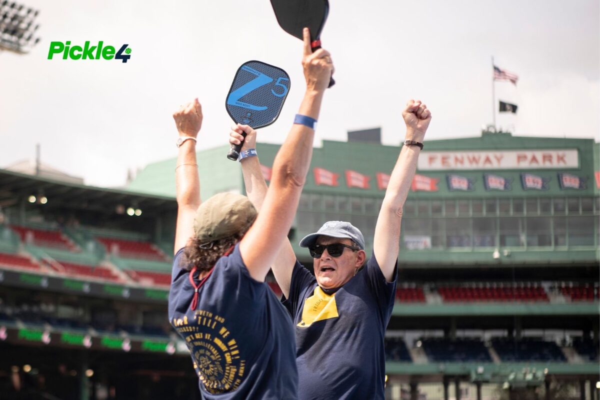 Pickleball players celebrating on court and supporting mental wellbeing