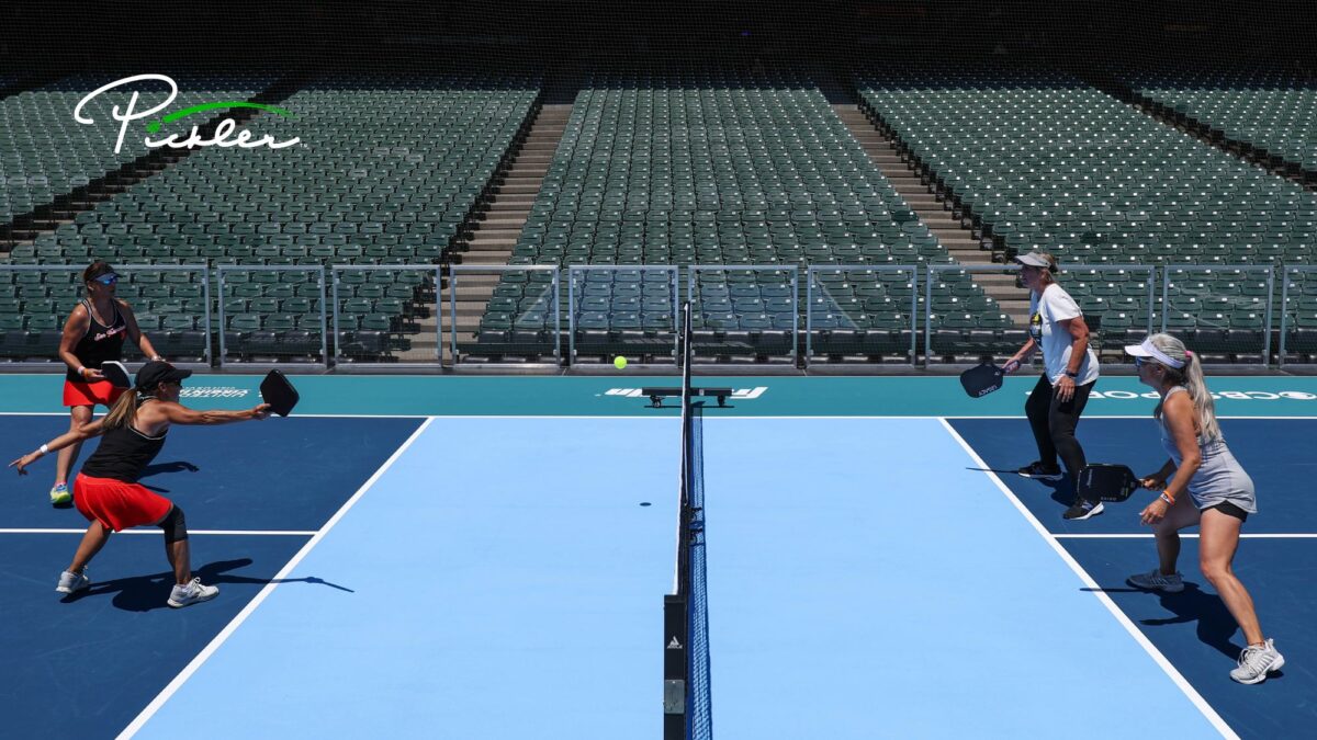 Pickleball players competing on court